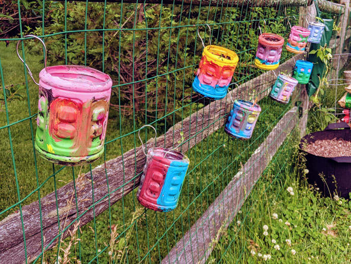 Fence Herb Planters Connected to Wire Split Rail Fence, Painted Gatorade Bottle Flower Pots