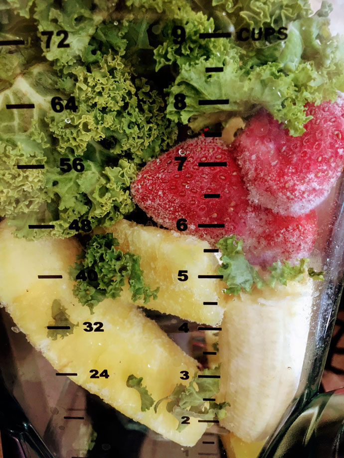 Kale Strawberry Pineapple Smoothie Ingredients Fresh Fruit and Veggies in a Blender