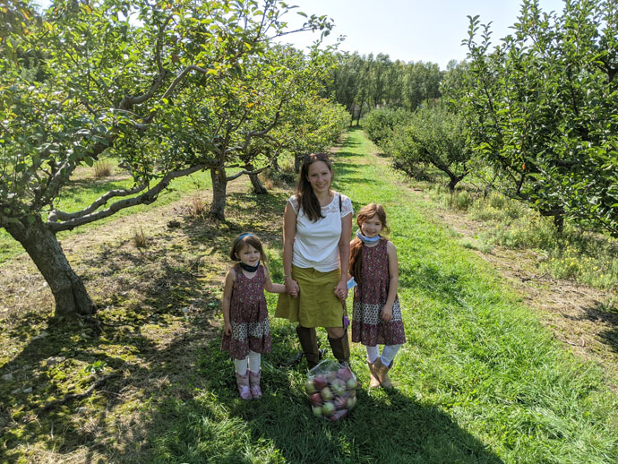 Mom and Two Daughters at Pick-Your-Own Apples Orchard