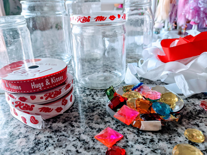 Reusing Old Candle Jars in Kids Crafts - Valentine's Day Vase for Flowers - Supplies of Valentine Ribbon, Rhinestones, and Empty Glass Jars