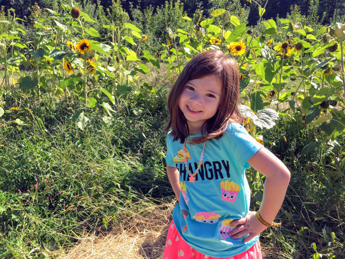 Daughter in a cut-your-own Sunflower Field