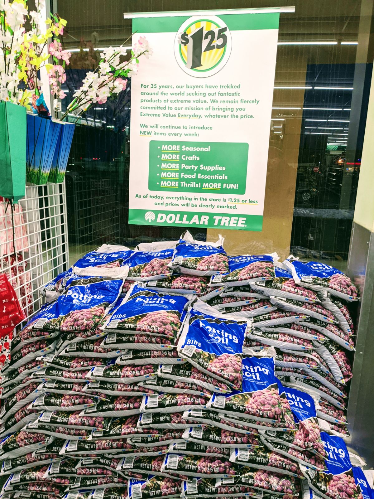 Pile of potting soil near the Dollar Tree price increase sign in 2022