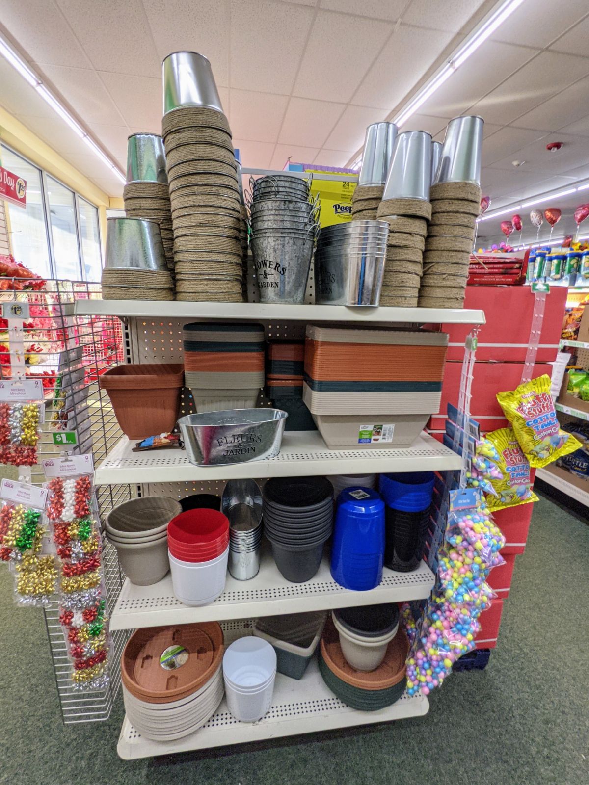 Shelves of flower pots of many kinds at the dollar store