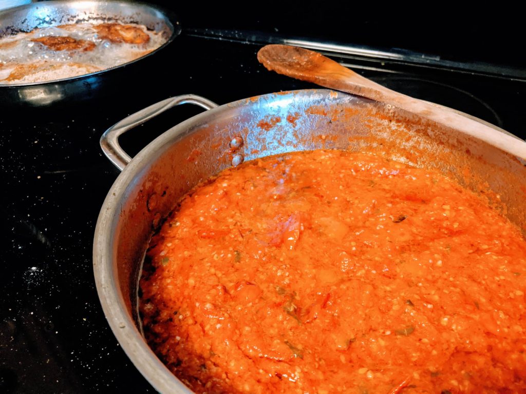 Homemade Spaghetti Sauce from Roma Plum Tomatoes with Chicken Cutlets in the Background