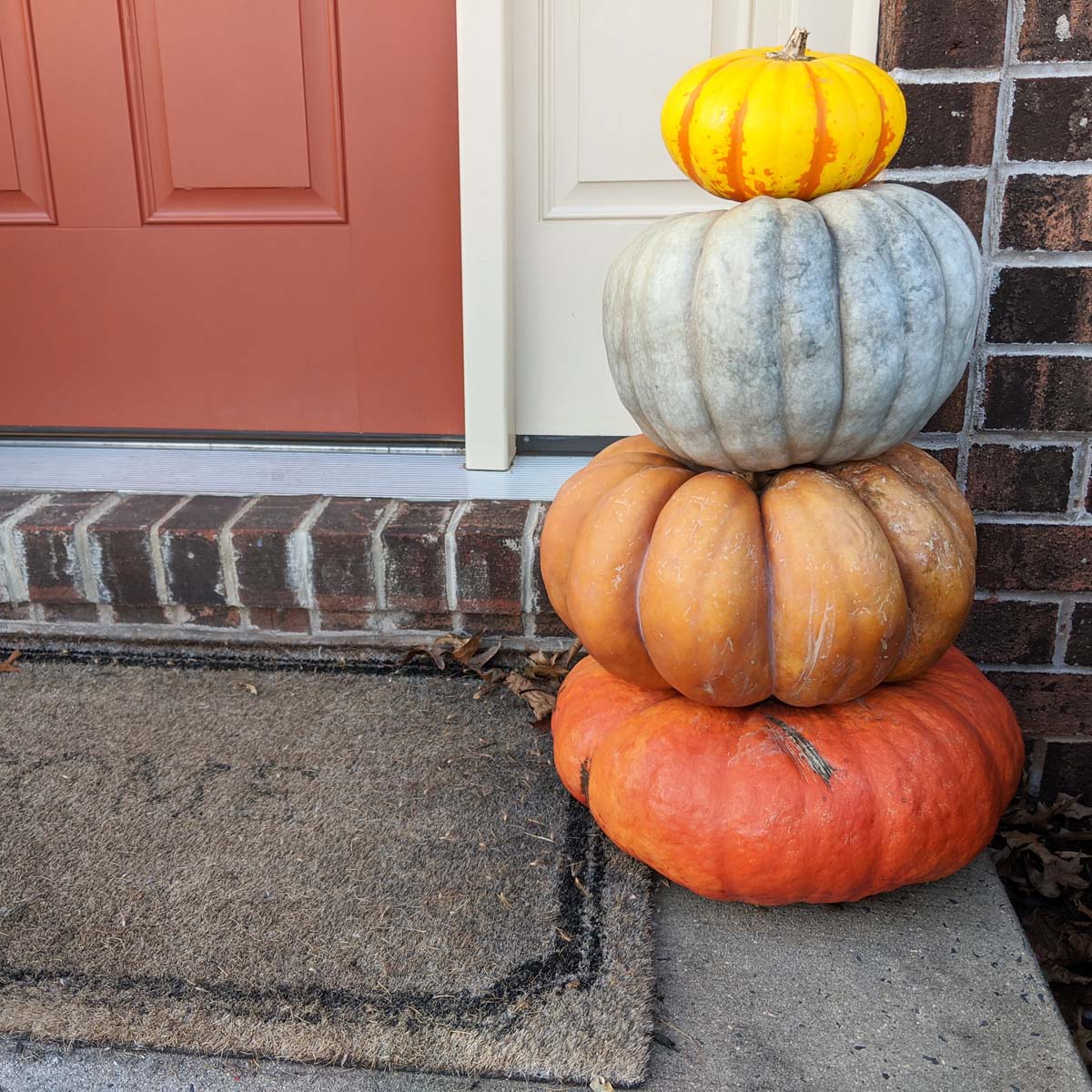 Decorative Pumpkins in a Stack on Front Step