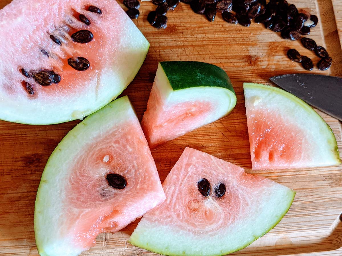 How to Harvest Watermelon Seeds - Cut Watermelon on Cutting Board with black seeds