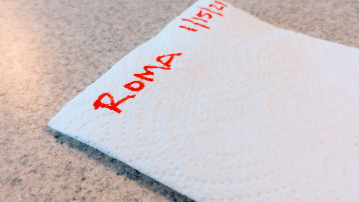 Roma written on white paper towel for saving tomato seeds