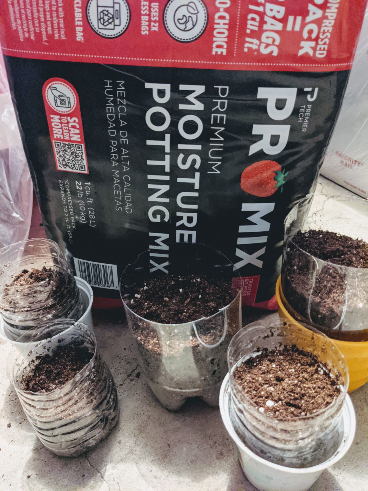 Pink bag of Pro-Mix soil with pots ready for rooting some cuttings