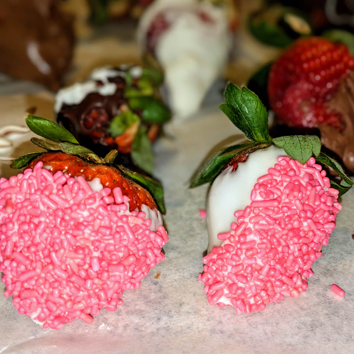 Chocolate-Covered Strawberries with pink jimmies sprinkles for decoration