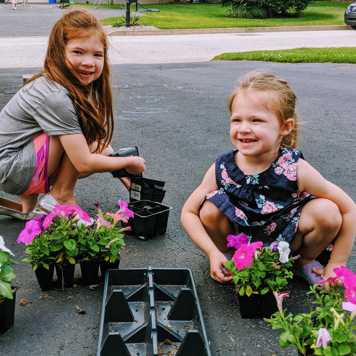 National Plant a Flower Day - Girls with a Flat of Annual Flowers