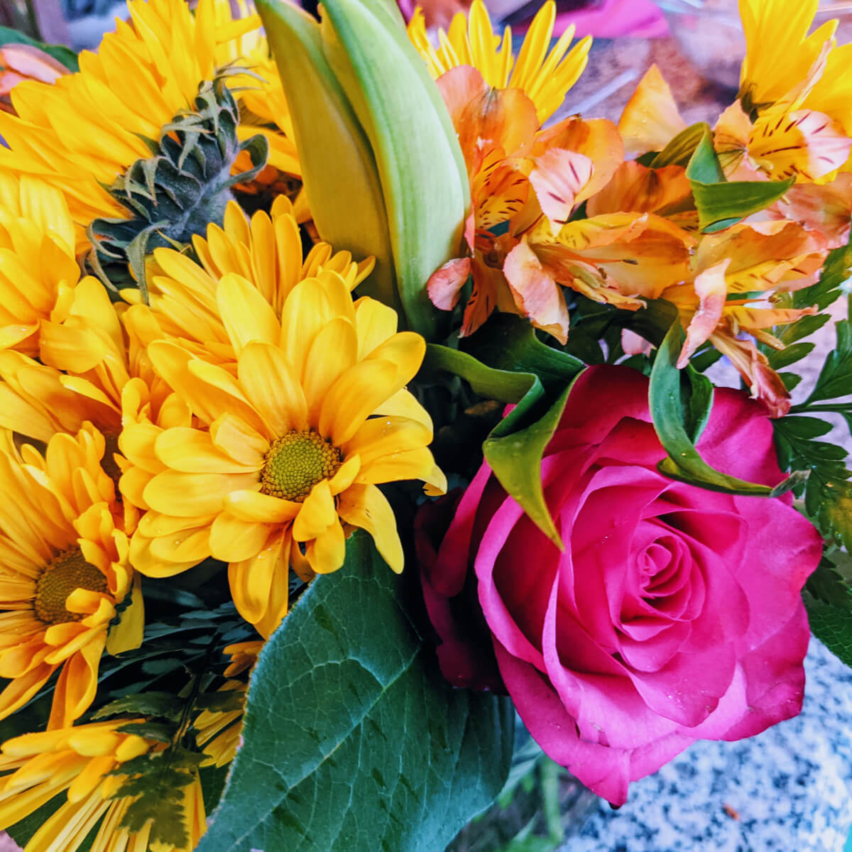 Beautiful bouquet of yellow, pink, and orange flowers - National Flower Day Ideas