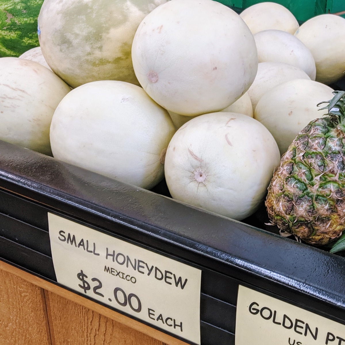 Honeydew Melons stacked up at a market