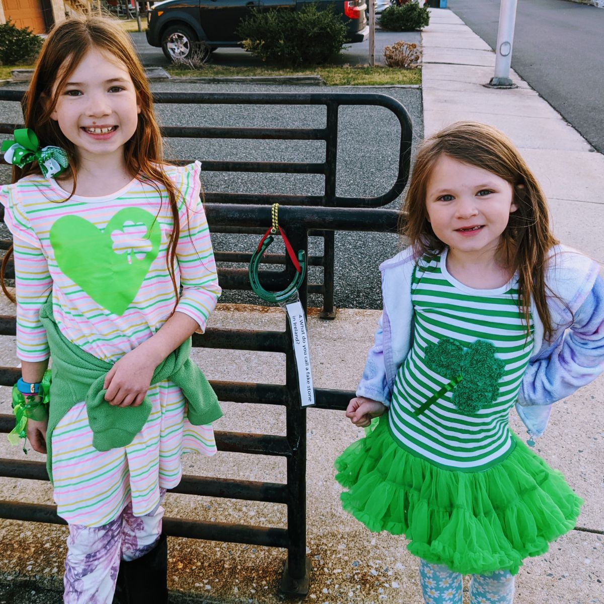 Sisters in St. Patty's Day dresses on a leprechaun hunt in Boyertown
