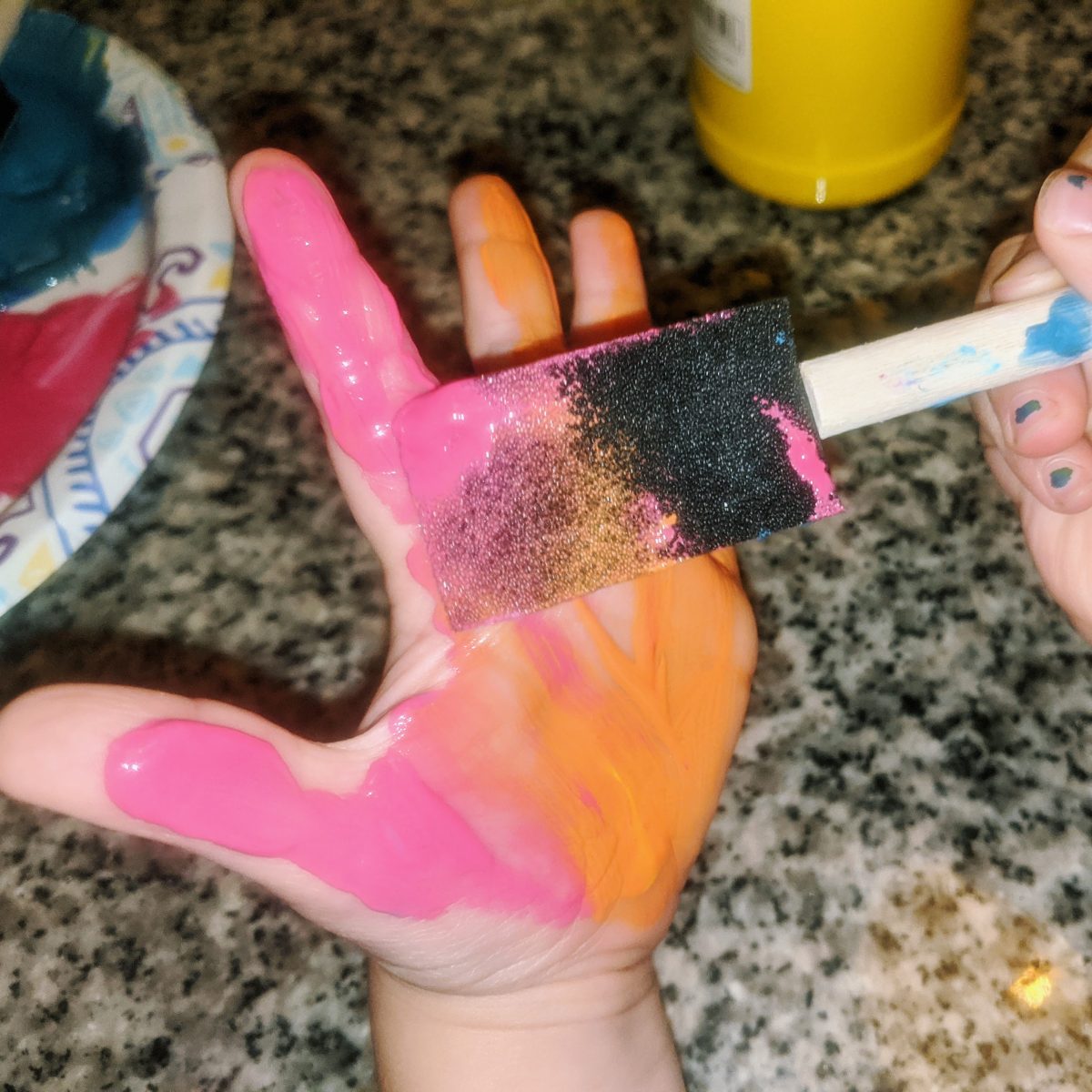 Painting Hand Pink and Orange with Sponge Brush Applicator