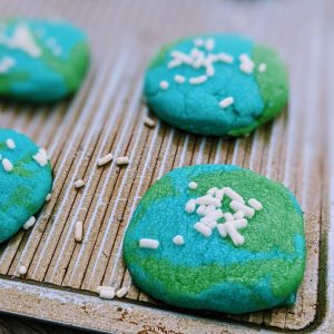 Baking Earth Day Cookies with Sprinkles for Clouds
