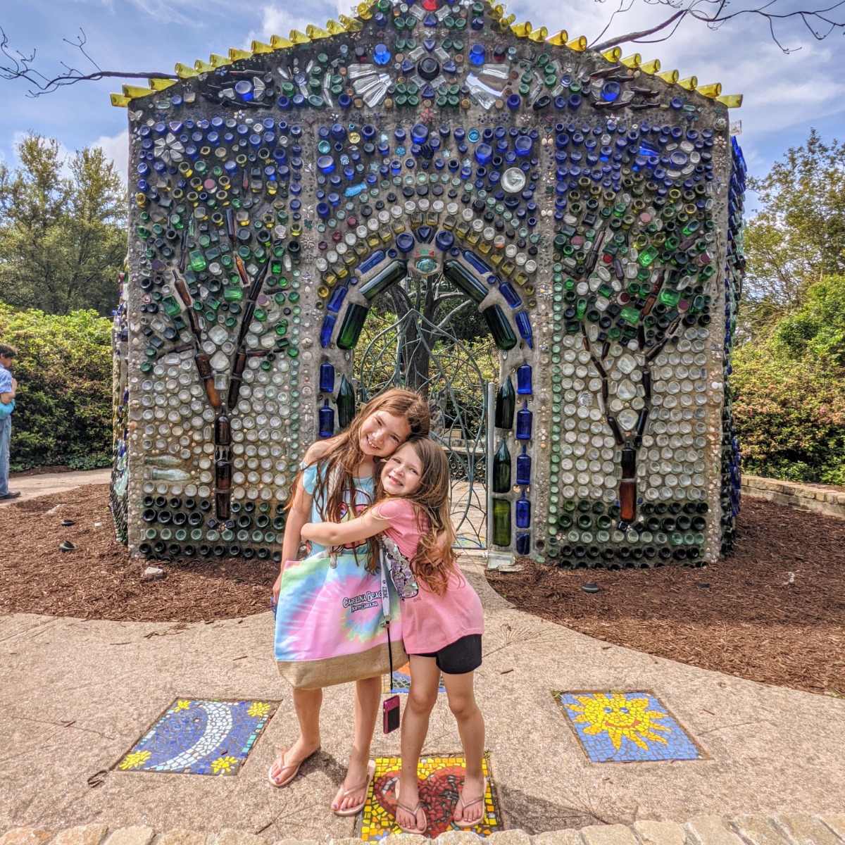 Sweet sisters enjoying the Bottle Chapel at Airlie Gardens in North Carolina