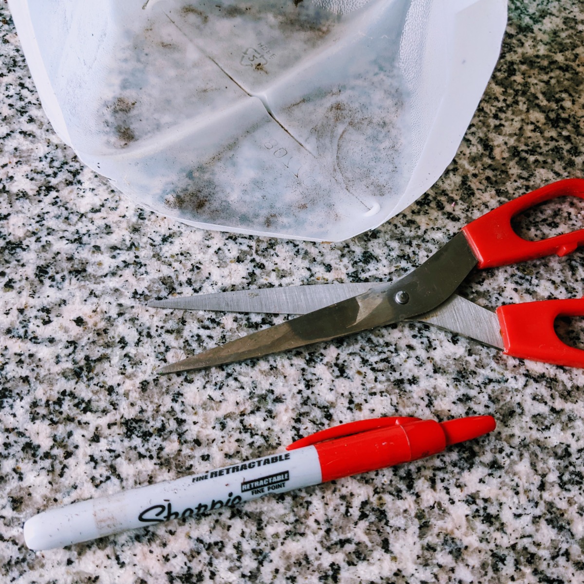 Cut apart a milk jug to make plant tags