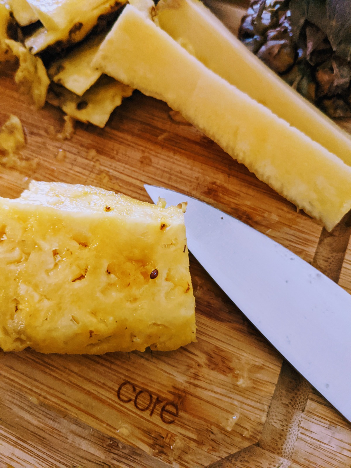 Where to find pineapple seeds - chunk of pineapple and knife on cutting board