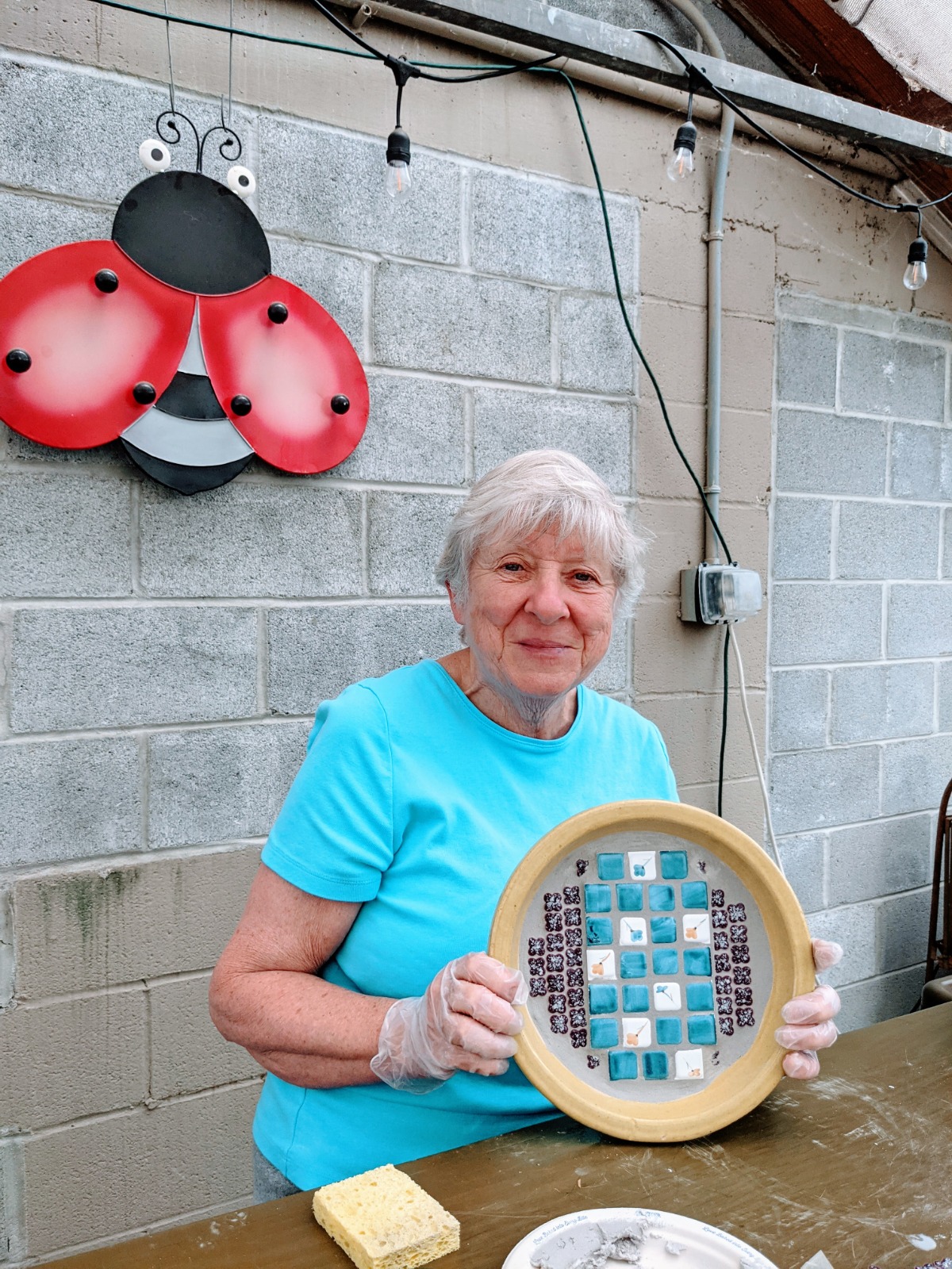 Lola Seymour of Millersville made a beautiful pollinator water dish using tiles and grout.