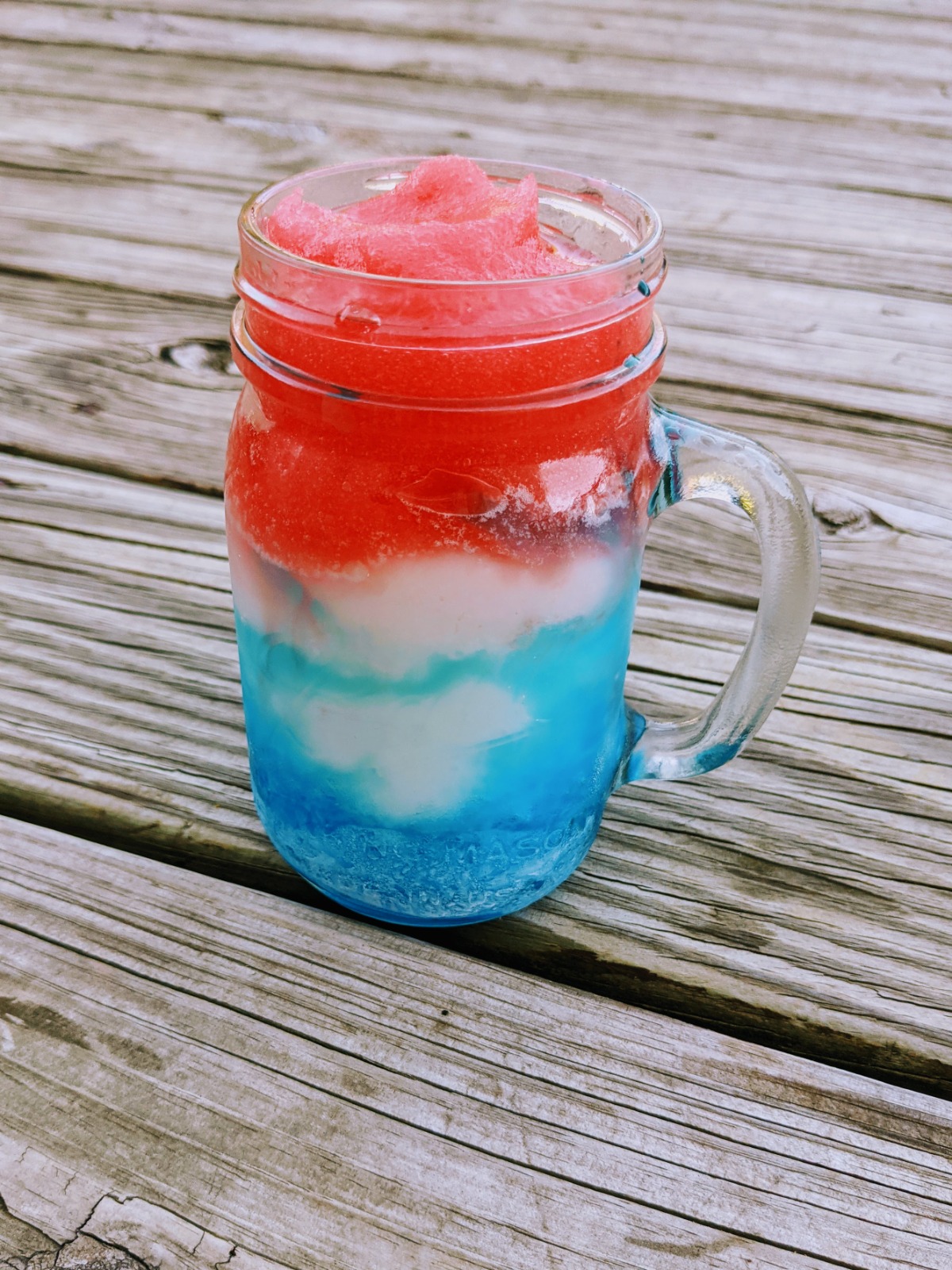 Red white and blue frozen drink mixed with blue raspberry, Pina colada and strawberry daiquiri