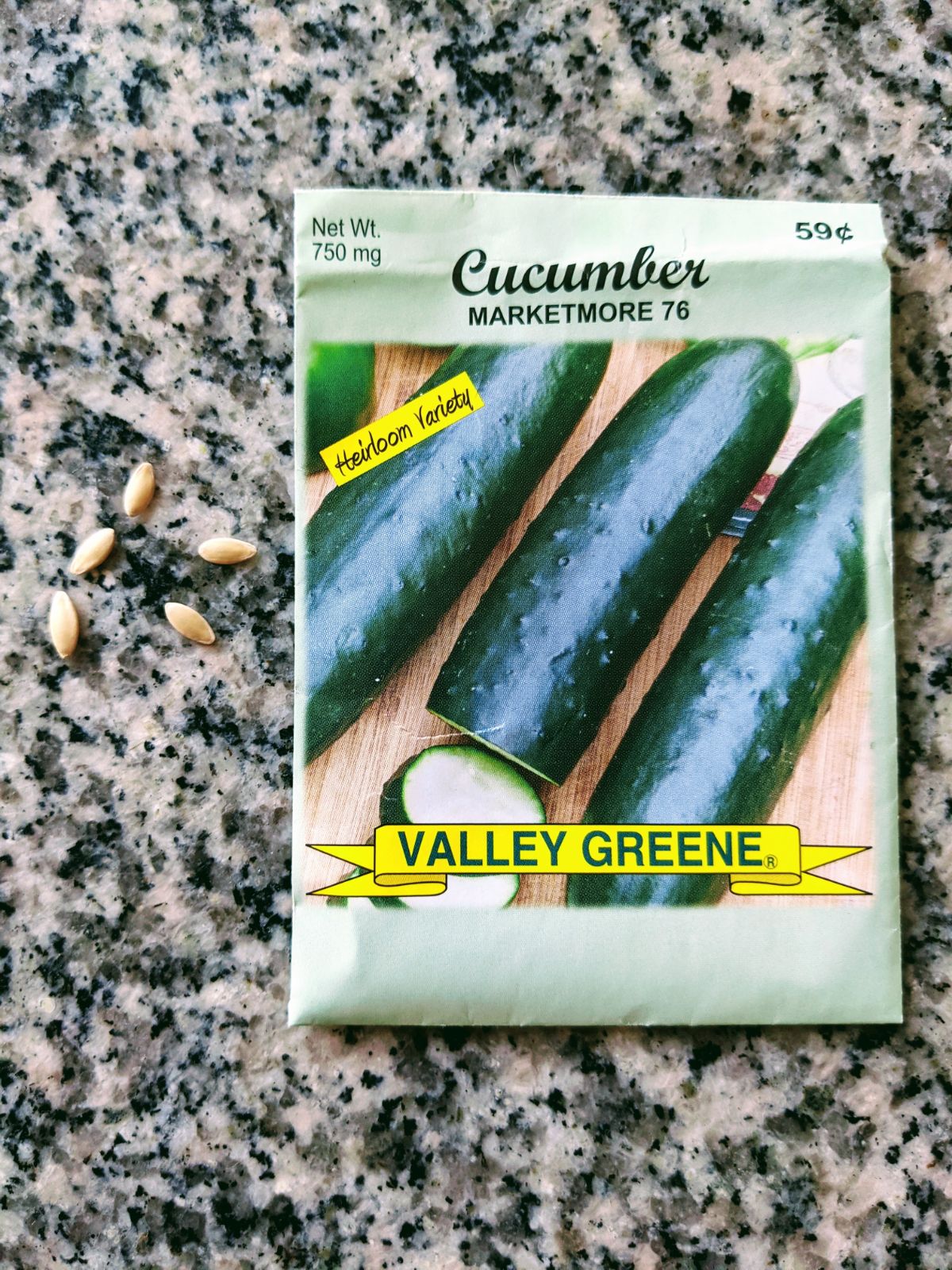 Marketmore 76 cucumber seeds and packet on a granite table