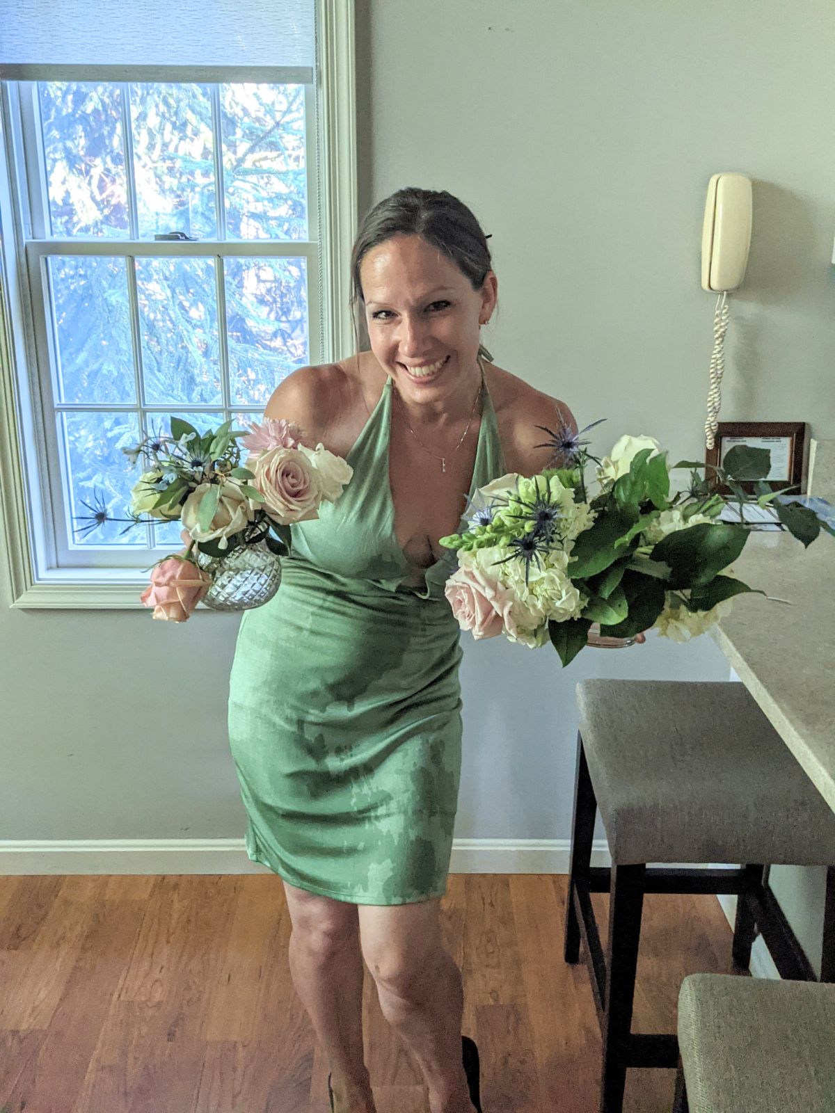 Kate holding wedding flowers that spilled water everywhere