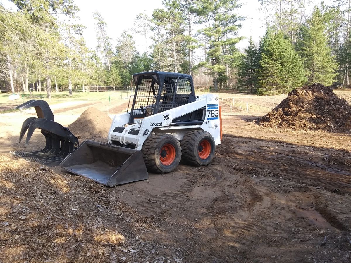 Compost scoop construction vehicle, massive compost operation; Photo courtesy of Paul Lueders