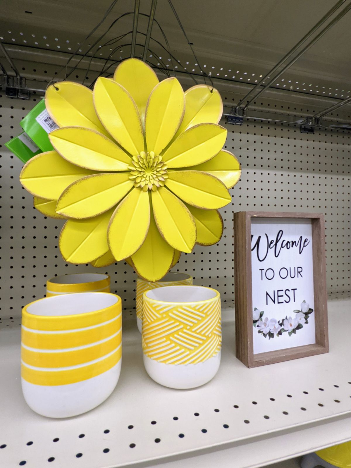 Welcome to our nest sign and yellow planters